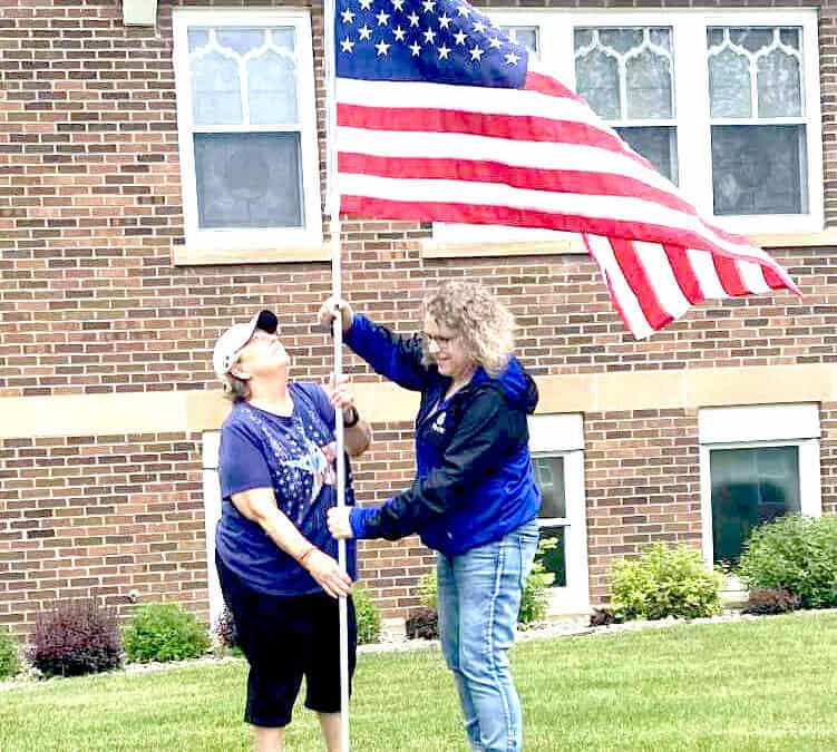 Avenue of flags displays community patriotism
